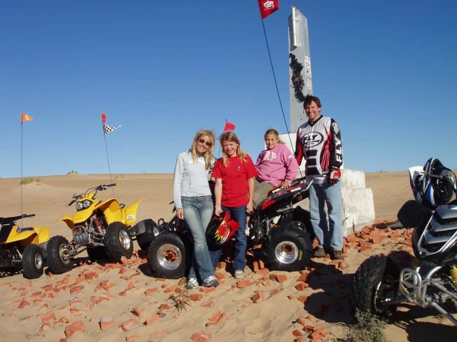 A family riding ATVs 