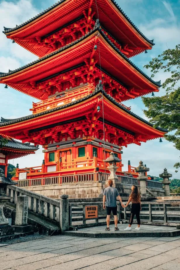 A couple standing in front of Kiyomizu-Dera Temple in Kyoto, Japan