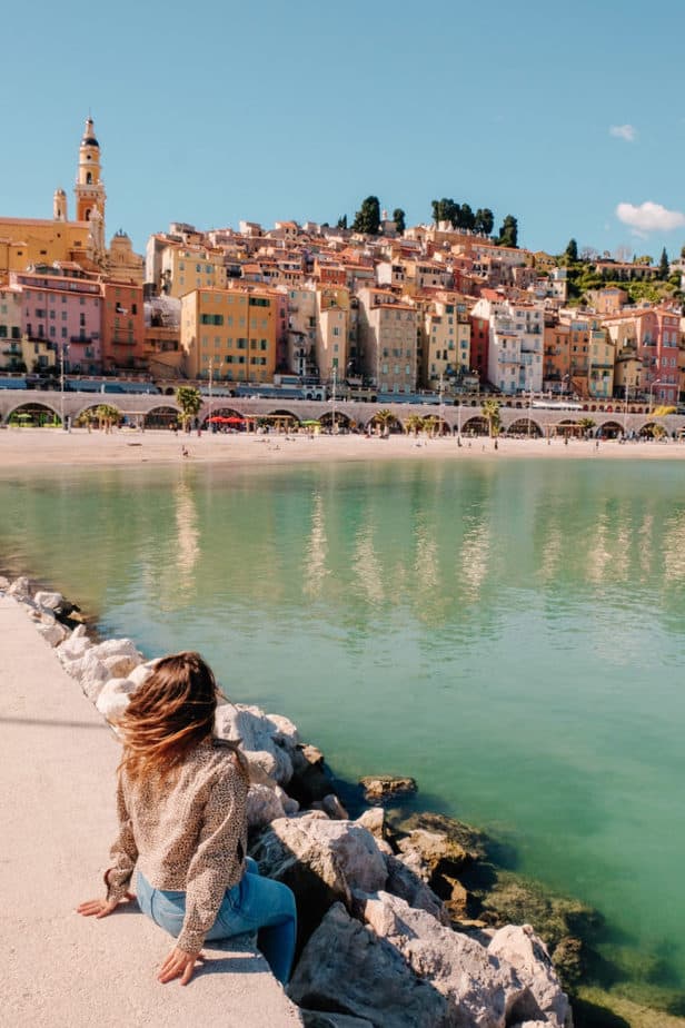 Girl sitting in front of view in Menton, France