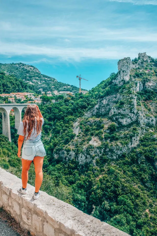 girl standing in front of view of Eze Village 