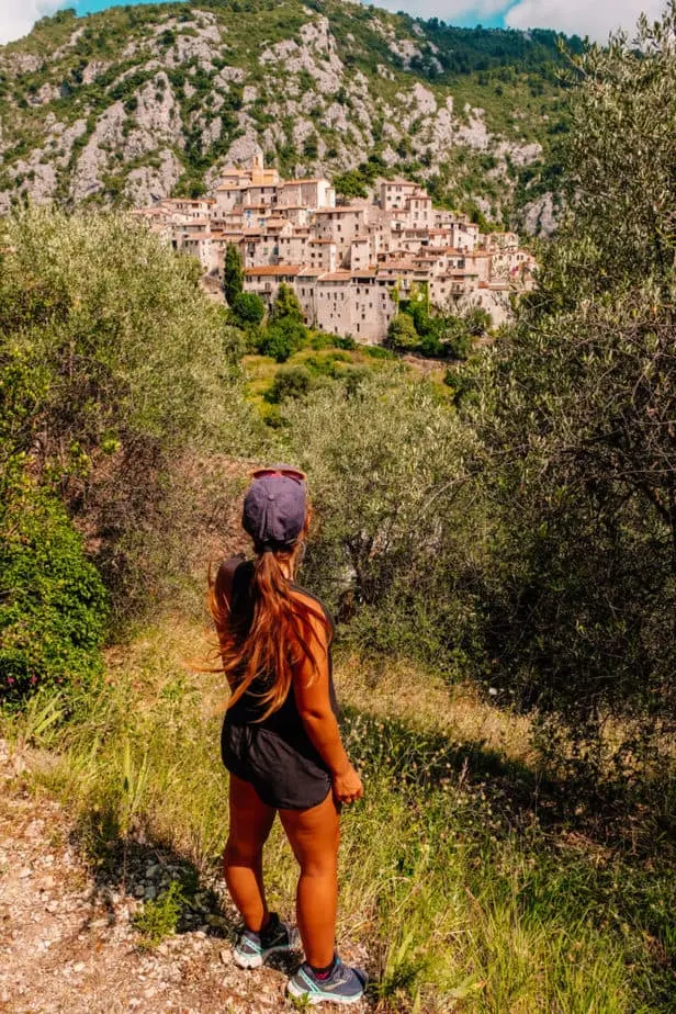 girl standing in front of Peillon Village