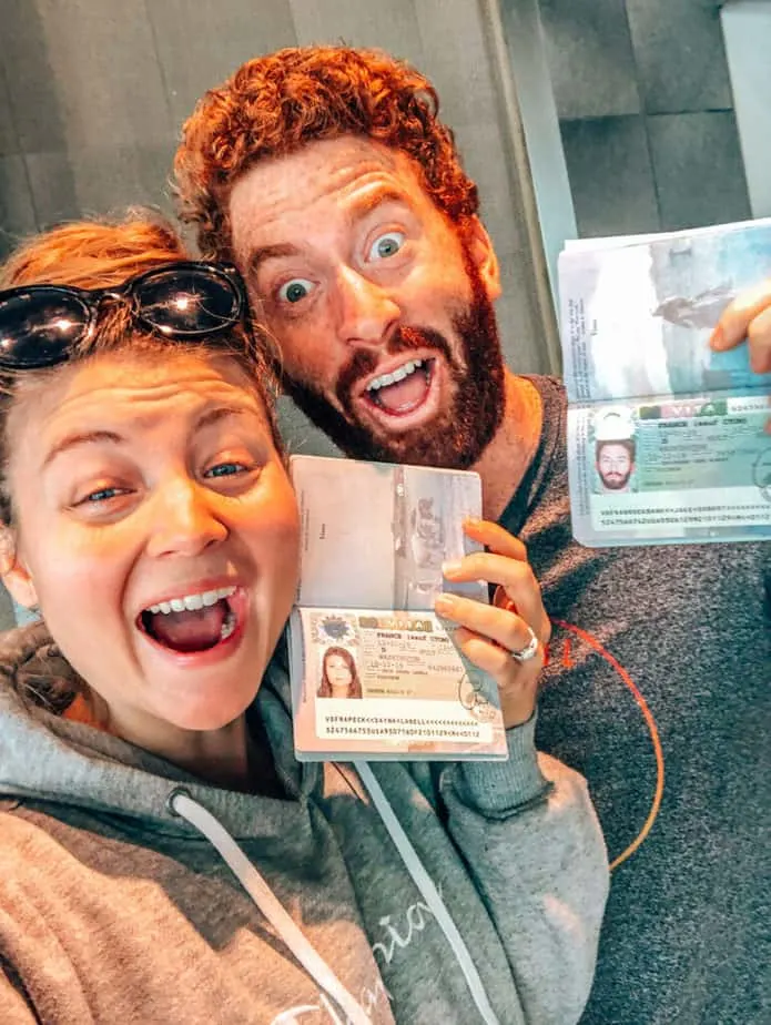 two people holding visas to France