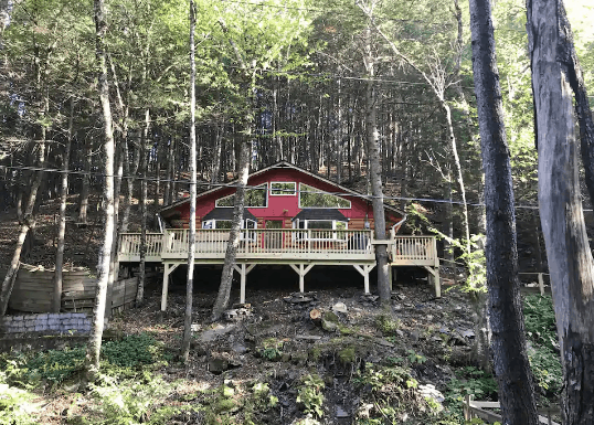 Red cabin on a hill in New York
