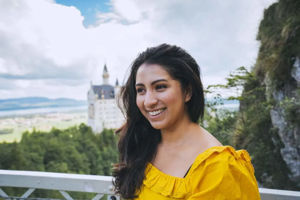 girl in front of Neuschwanstein Castle while working abroad in Europe