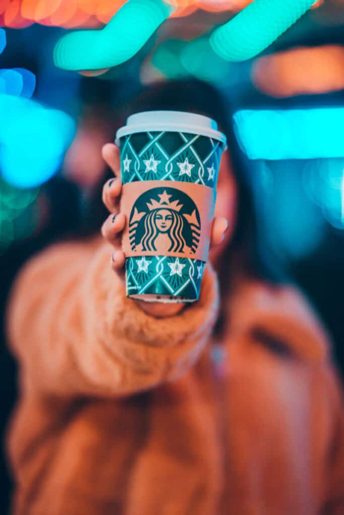 girl holding Starbucks cup