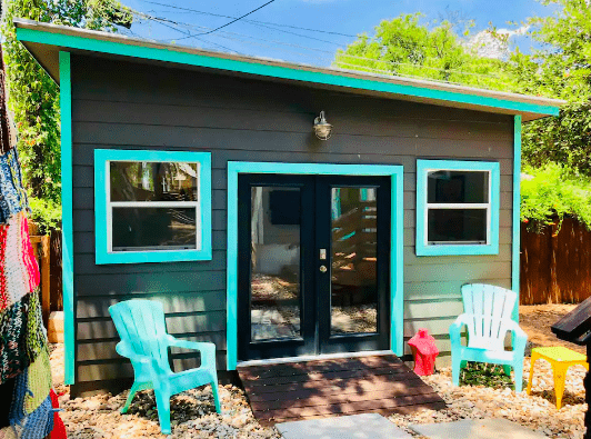 blue and gray tiny house with slanted roof in Austin, Texas