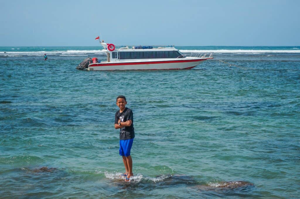 Child and a ferry in Bali
